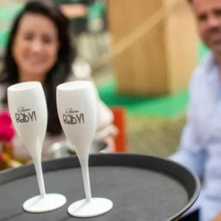 Sektglas WELCOME BABY! - weißes Kunststoff Champagnerglas mit Botschaft