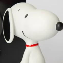 Snoopy Buchstütze – Peanuts Bücherhalter schwarz mit Snoopy Figur